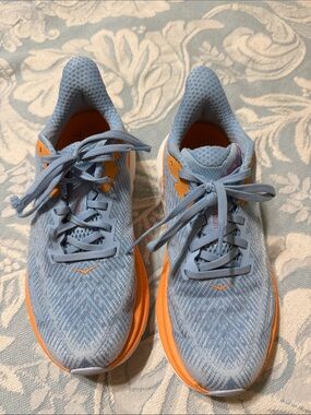 Hoka Light Blue Running Sneakers with Orange Trim and Pink Logo
